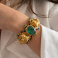 Emerald Lion Repoussé Navratan Bead Gold Bracelet